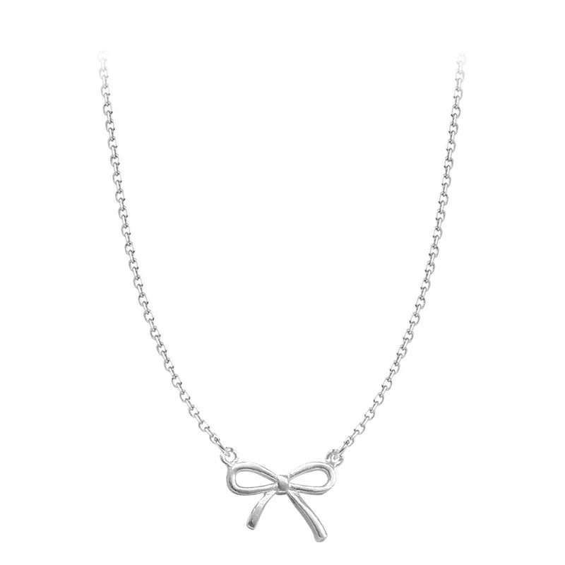 Collier avec pendentif en forme de nœud papillon en argent pour femme