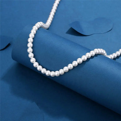 Collier ras du cou en chaîne de perles blanches