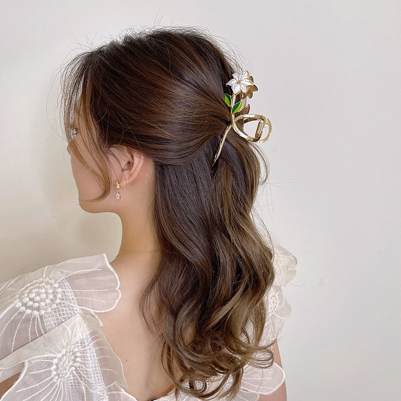 Elegante goldene Blumen-Haarspange