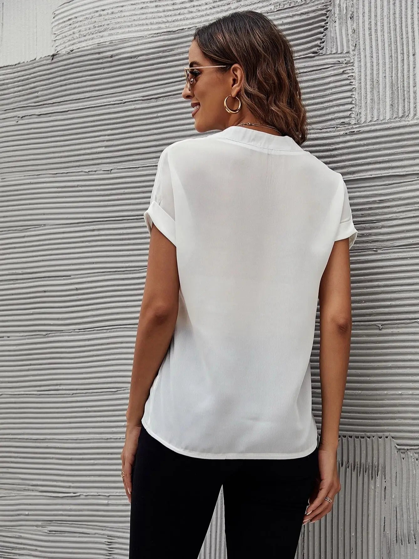 Chemise Unity pour femmes à manches chauve-souris blanches unies