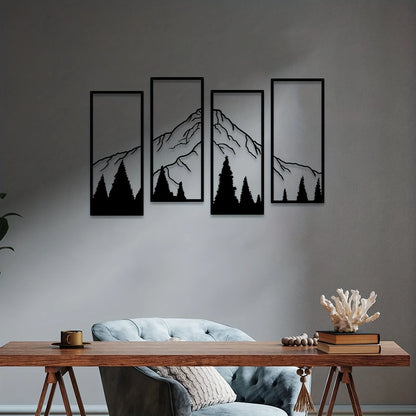 Four framed mountain silhouettes on a wall above a sofa with decorative items.