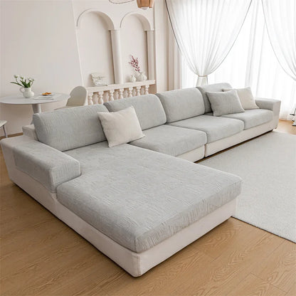 Canapé d'angle et fauteuil en L au design épais