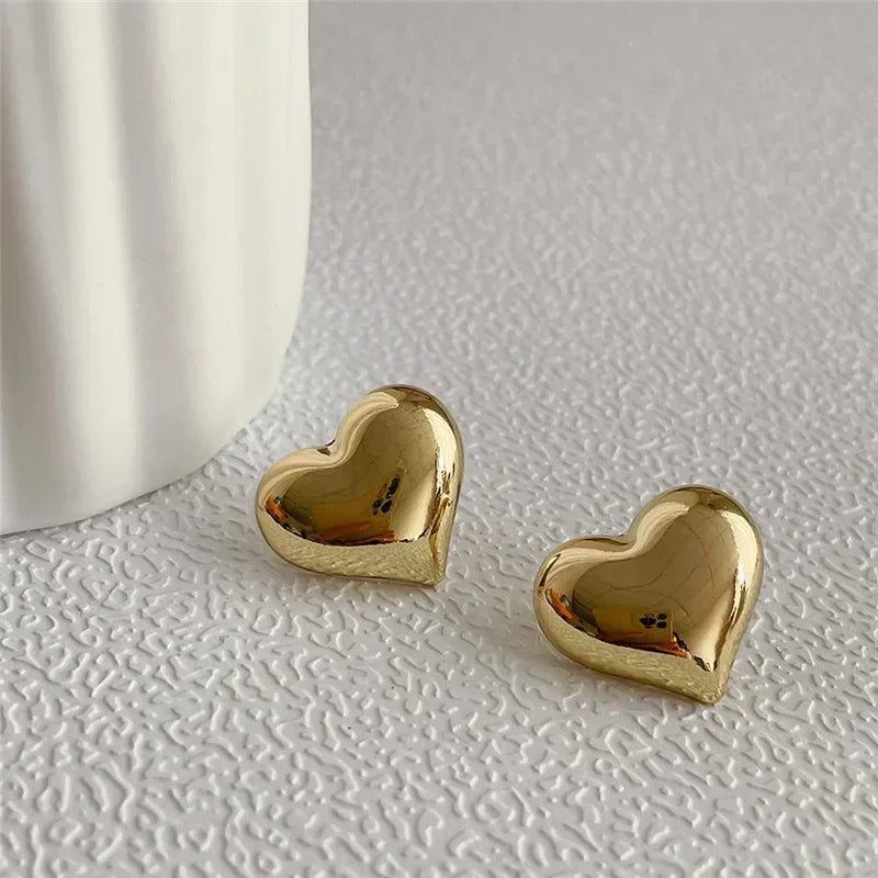 stud earrings, earrings gold, earrings women, gold heart, stud earrings gold, heart shaped earrings, gold heart earrings, women stud earrings, heart earrings, heart shaped stud earrings, stud earrings for women gold