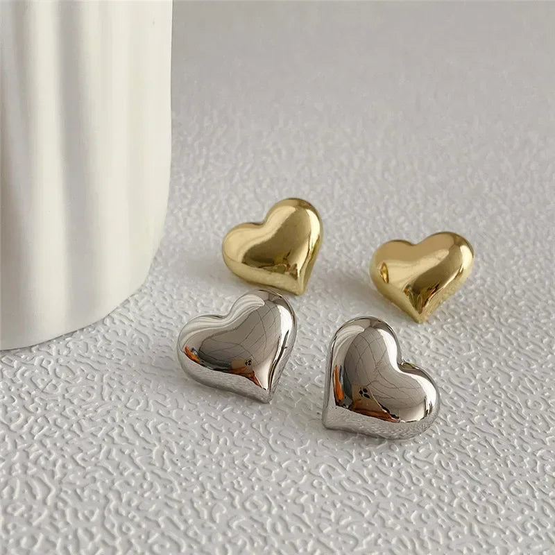 stud earrings, earrings gold, earrings women, gold heart, stud earrings gold, heart shaped earrings, gold heart earrings, women stud earrings, heart earrings, heart shaped stud earrings, stud earrings for women gold