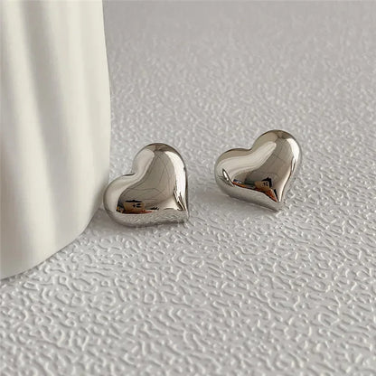 stud earrings, earrings gold, earrings women, gold heart, stud earrings gold, heart shaped earrings, gold heart earrings, women stud earrings, heart earrings, heart shaped stud earrings, stud earrings for women gold
